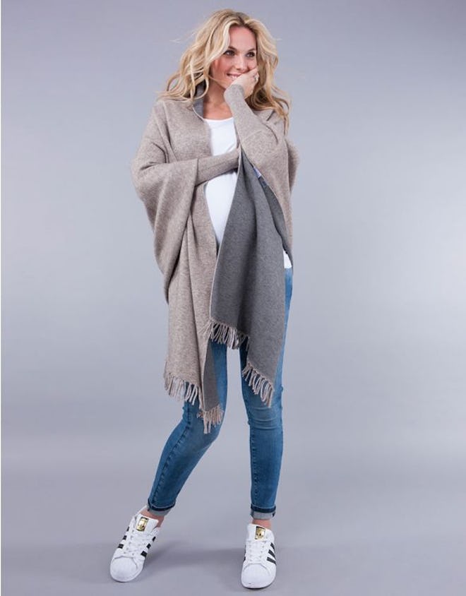 Pregnant woman modeling two-tone grey shawl