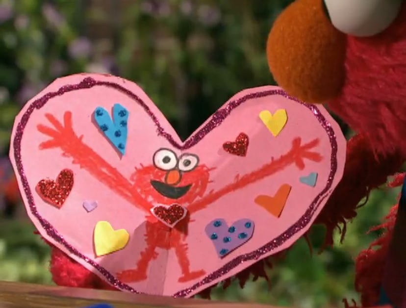 Elmo creates a valentine for his friend.