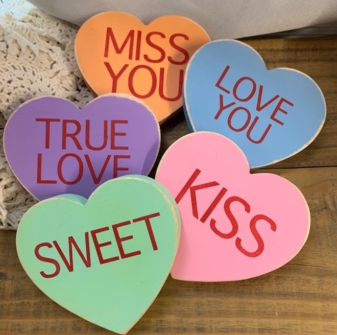These wooden conversation hearts are a cute Valentine's Day decoration.