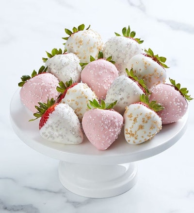 Cake stand filled with white-chocolate covered strawberries