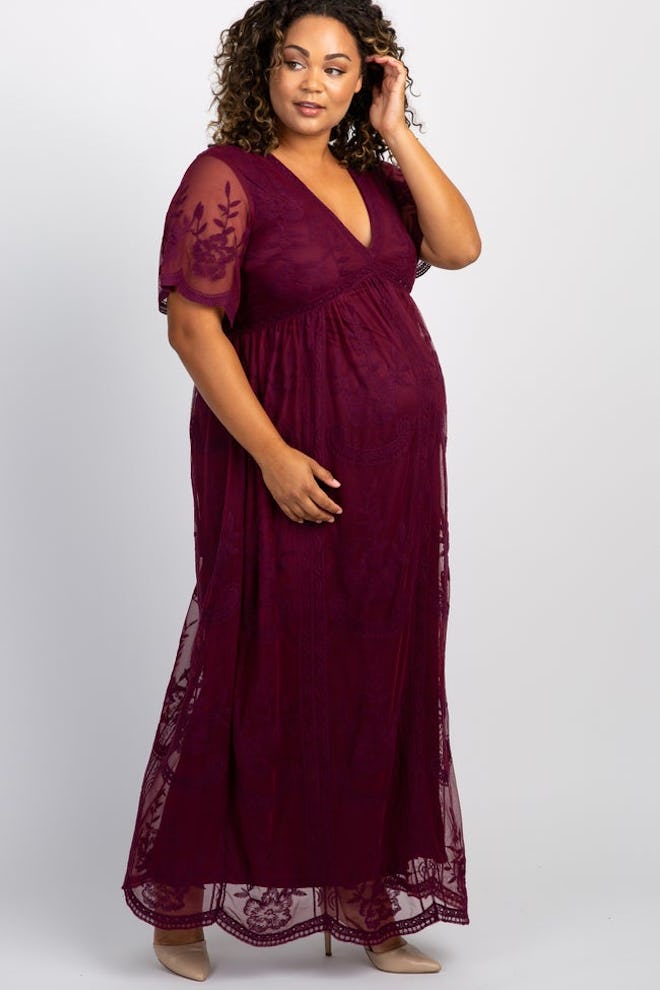 Pregnant woman modeling burgundy maxi dress