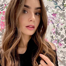 Lily Collins long waves engagement ring floral background