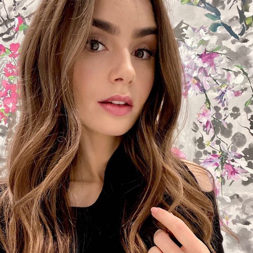 Lily Collins long waves engagement ring floral background
