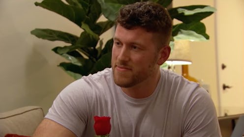 Bachelor Clayton Echard offering Salley a rose during his season premiere