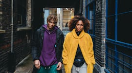 Young couple walking in the street in a funk because they're two of the unlucky zodiac signs who wil...