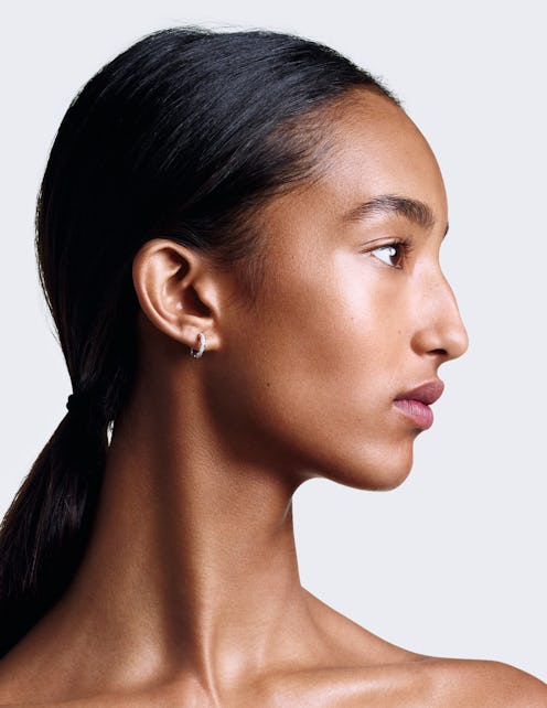 Chanel red camellia collection model in profile