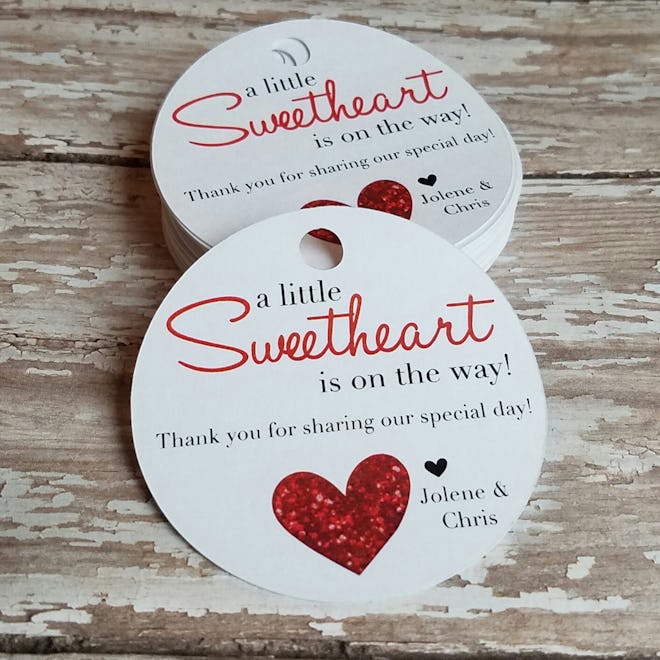 Gift tag that reads "A Little Sweetheart Is On The Way"