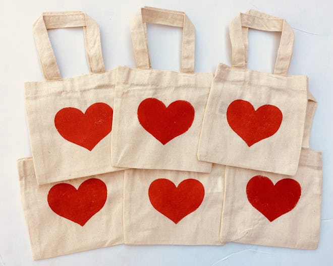 6 canvas bags with red hearts printed on the front