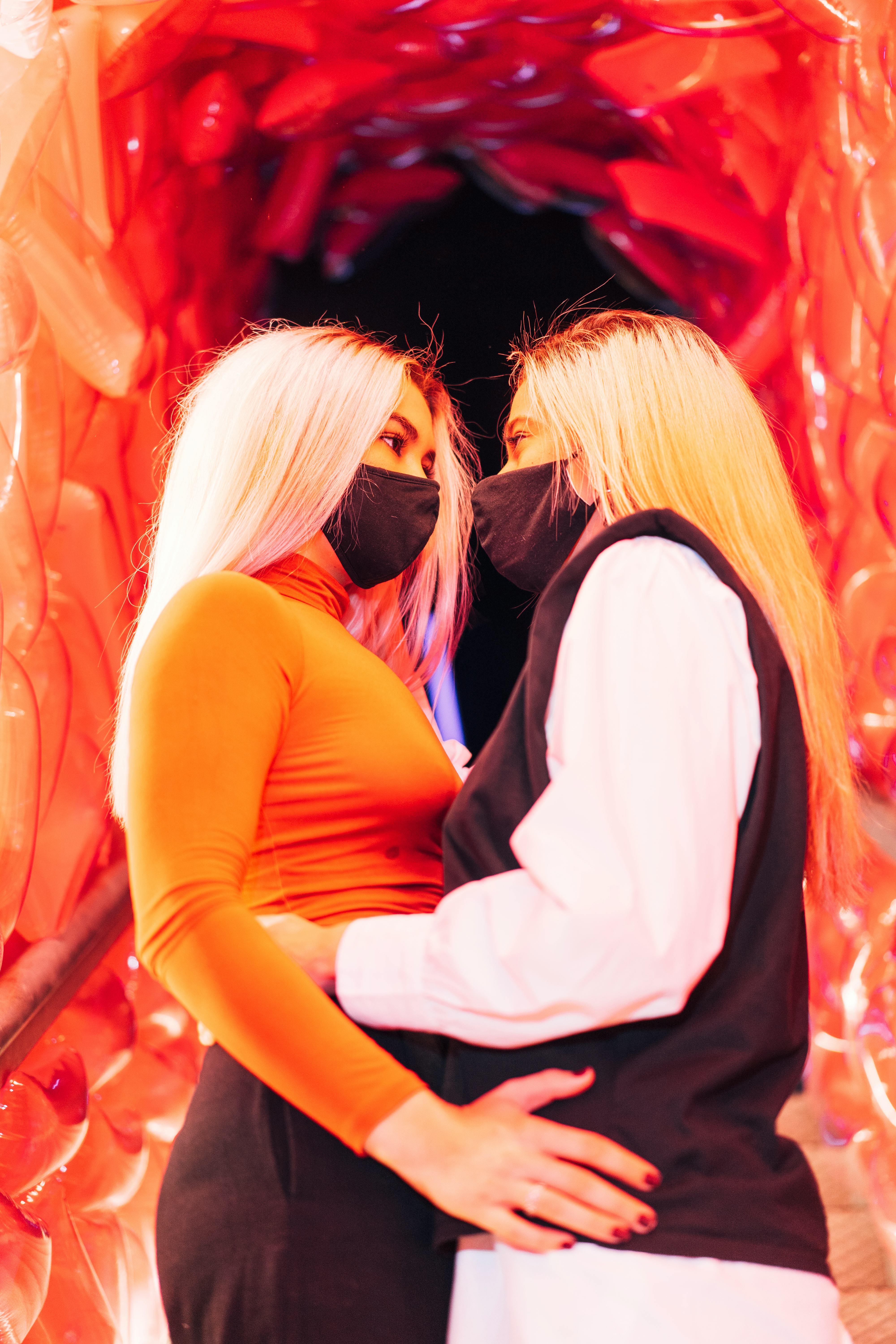 A young couple wearing masks and holding each other on Feb. 16, 2022, the most romantic day of the m...