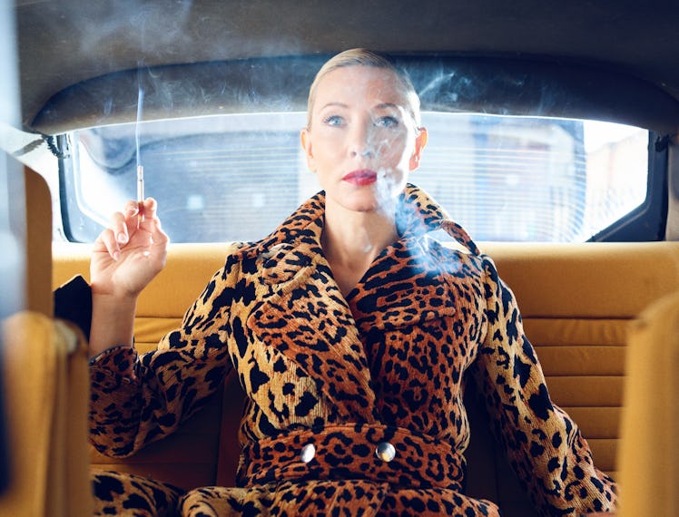 Cate Blanchett in back of a car.