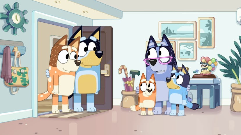Nana stands in her apartment with her arms around Bluey and Bingo as Chilli and Bandit stand in the ...