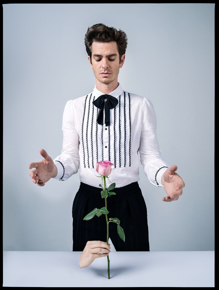 Andrew Garfield wears a Saint Laurent by Anthony Vaccarello shirt, pants, and bowtie.