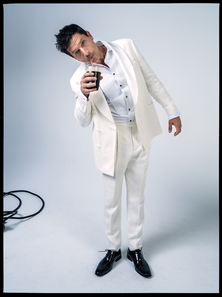 Simon Rex wears a Brunello Cucinelli tuxedo and shirt; Florsheim shoes.