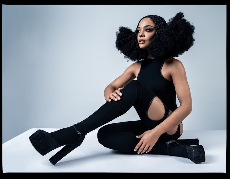 Tessa Thompson wears a Burberry jumpsuit; Giuseppe Zanotti shoes.