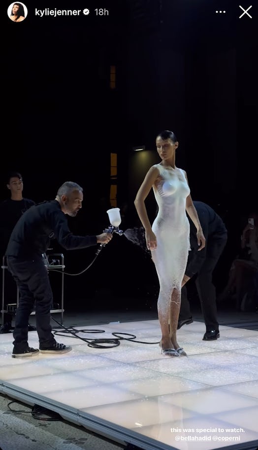 Kylie Jenner reacted to Bella Hadid’s spray-painted dress from Coperni’s Paris Fashion Week show.