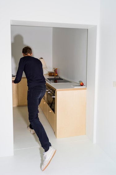 Bernard Dubois in his kitchen with birch plywood cabinetry