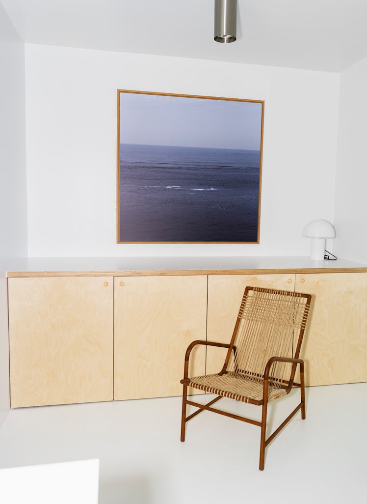 Bernard Dubois's chair, lamp, and a photograph of the North Sea.