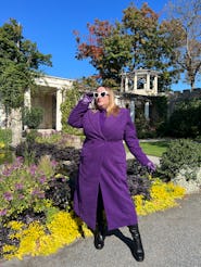 Sarah Chiwaya in purple coat from Sergio Hudson x Target