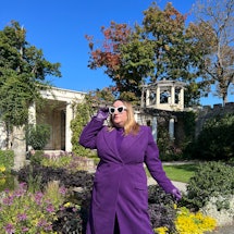 Sarah Chiwaya in purple coat from Sergio Hudson x Target