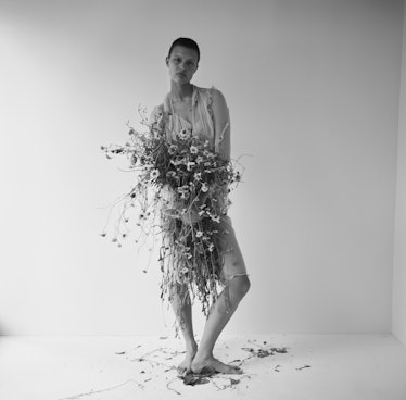 Model Celina Ralph holding a bouquet.