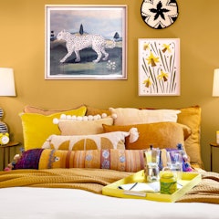 The House of HomeGoods has a yellow bedroom. 