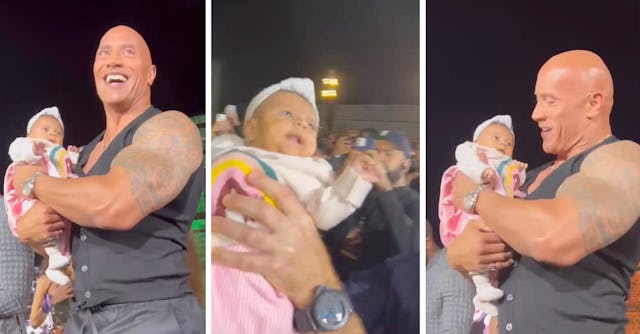 The Rock held the baby gently when he was passed the infant during a press event.
