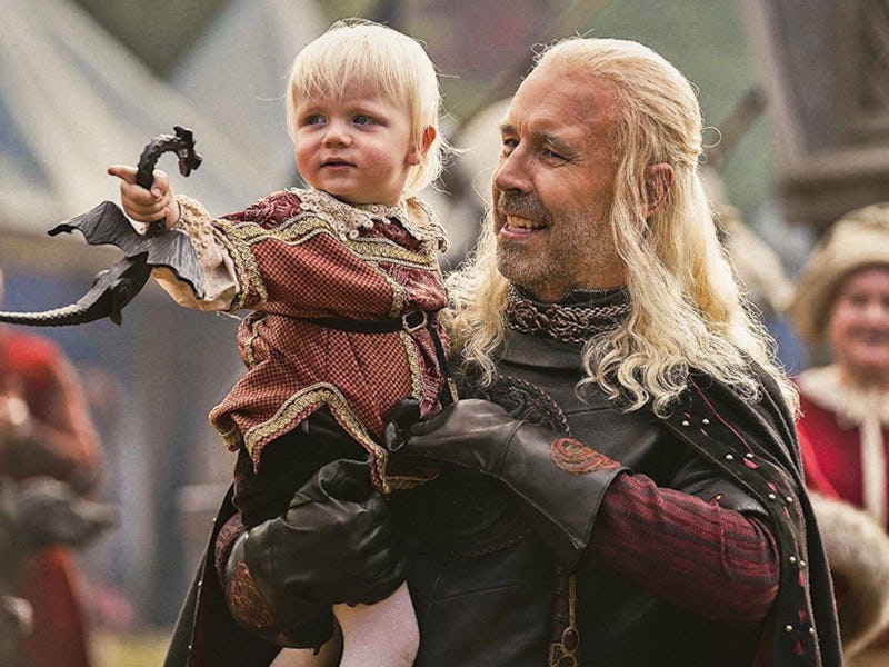 King Viserys I Targaryen holding his son Aegon II 