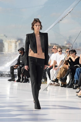 A model in a black suit at the Alexander McQueen spring 2023 fashion show