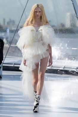 A model in a white tulle dress at the Alexander McQueen spring 2023 fashion show
