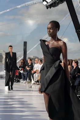 A model in a black gown at the Alexander McQueen spring 2023 fashion show