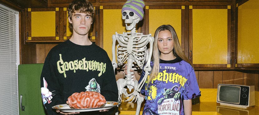 Two models posing in Dumbgood's 2022 Halloween collection in 'Goosebumps' inspired clothes.