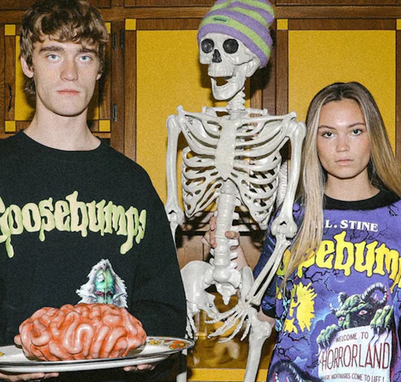 Two models posing in Dumbgood's 2022 Halloween collection in 'Goosebumps' inspired clothes.