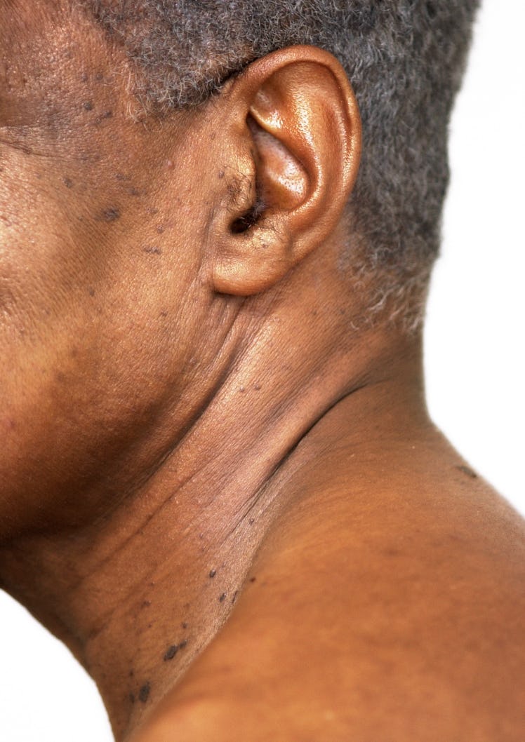 Close up on a man's ear hair.