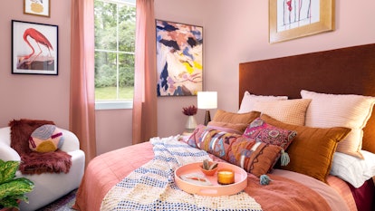 The House of HomeGoods has fully decorated rooms like this pink bedroom. 