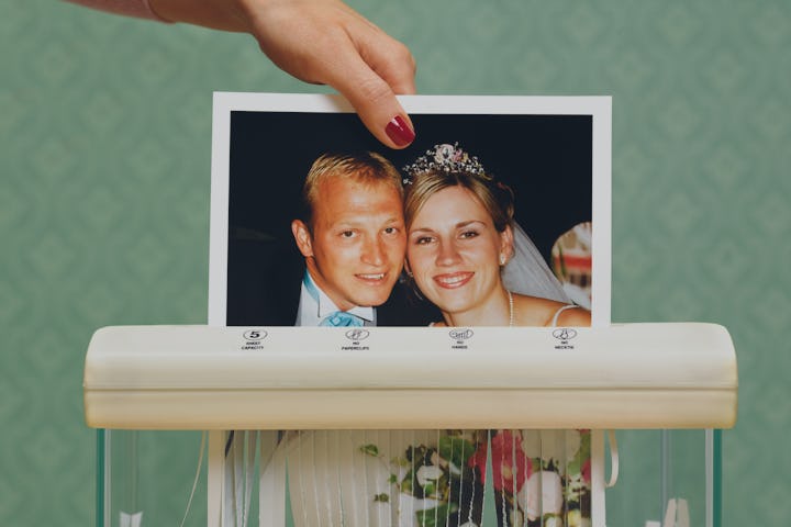 Picture of husband and wife on wedding day being shredded due to divorce