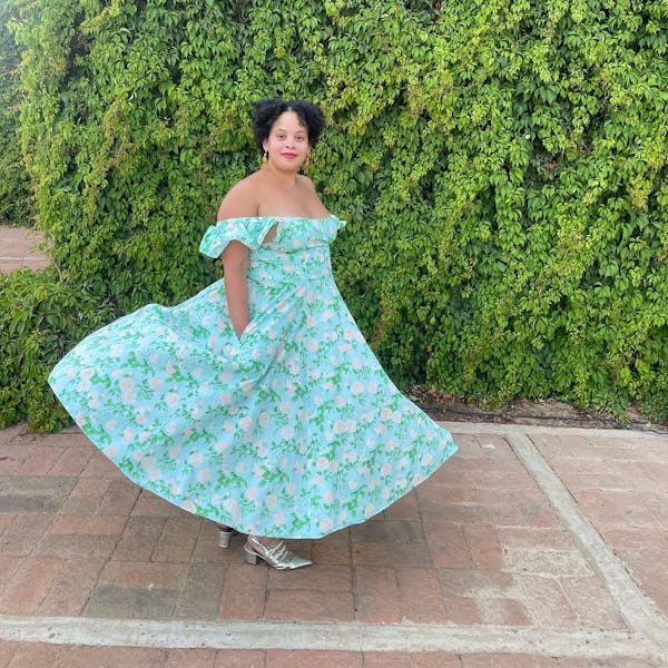 Natasha Marsh posing in a light blue wedding guest dress outfit