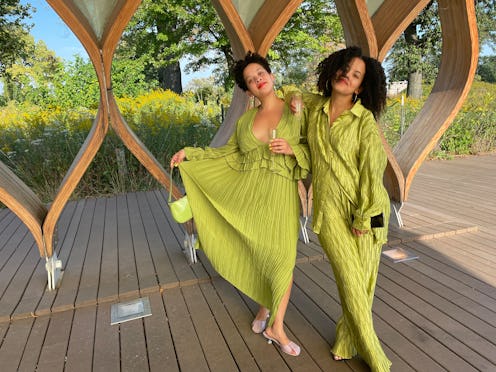 Two girls posing in light green dresses
