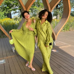 Two girls posing in light green dresses