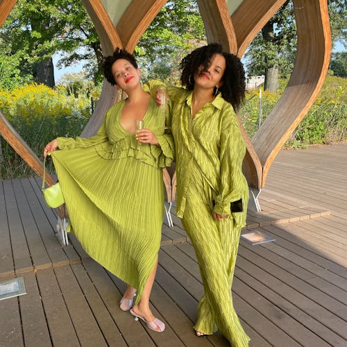 Two girls posing in light green dresses