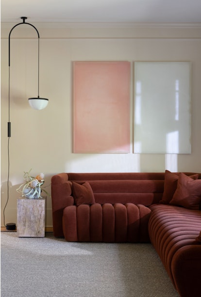 This living room features a super subtle pink decor idea