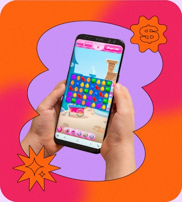 A person playing a game called Candy Crush on a mobile phone
