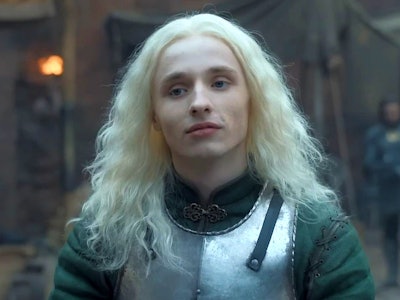 Aegon II Targaryen wearing a metal vest while standing 