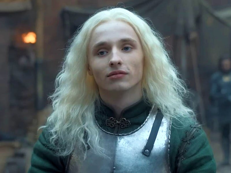 Aegon II Targaryen wearing a metal vest while standing