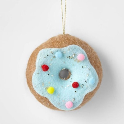brown donut with blue frosting and sprinkles as an ornament in an article about when does target put...