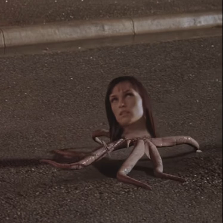 Famke Janssen's alien head grows tentacles and walks away. 