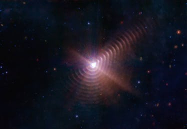 The two stars in Wolf-Rayet 140 produce shells of dust every eight years that look like rings, as se...