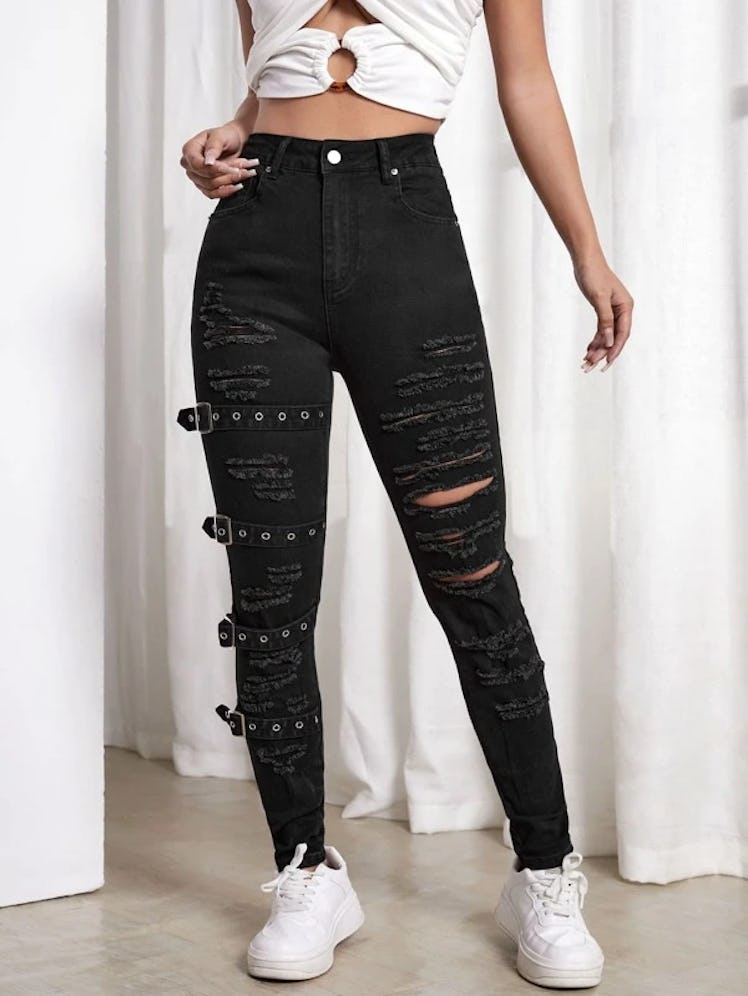 ripped buckled skinny jeans