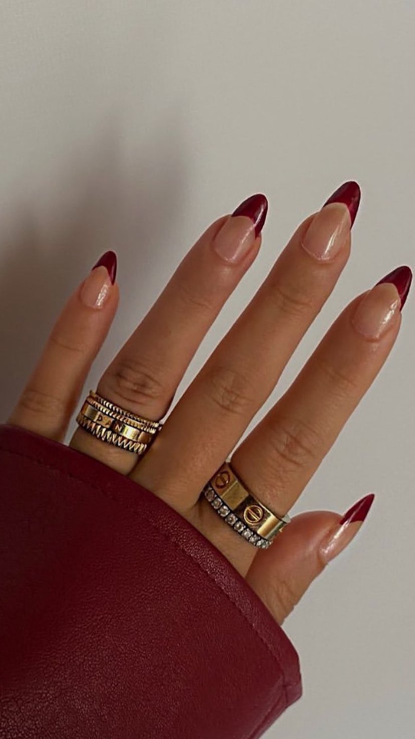 maroon french tip nails with matching sweater