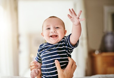 A baby waving.