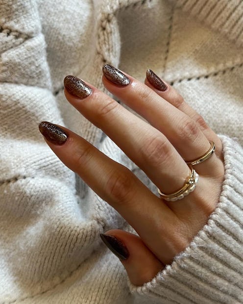 Here are different shades of brown nail polish — from chrome to dark mocha — to wear all fall 2022 a...